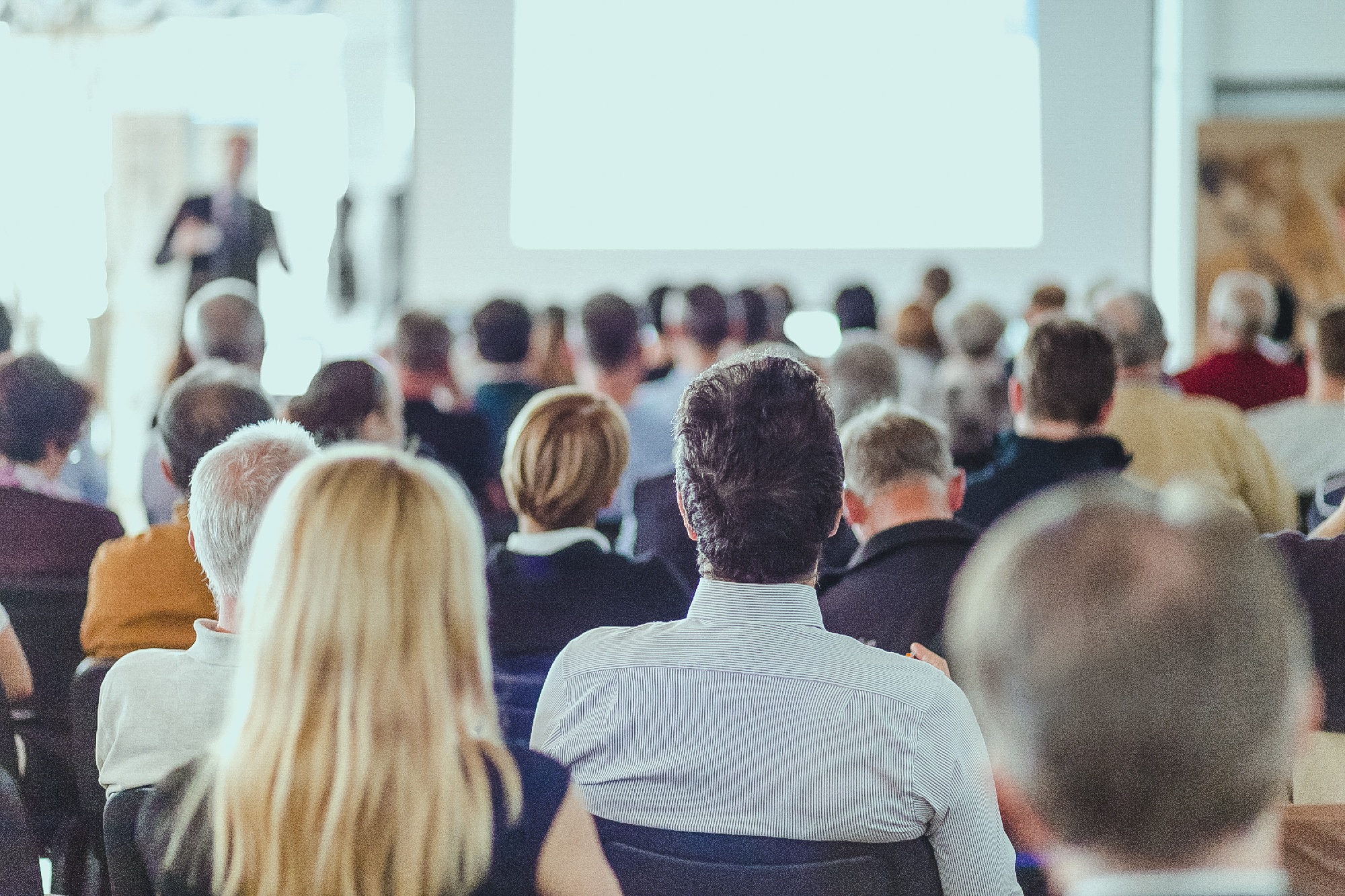 rear-view-unrecognizable-people-audience-conference-hall-1